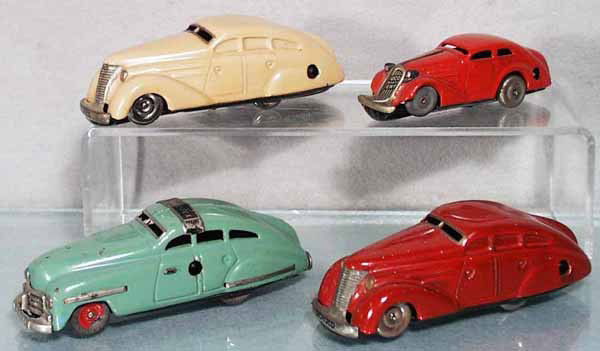 4 SCHUCO AUTOS: 1010 Auto, 1000 Patent Auto, 1111 Fex, missing hood ornament, hub cap chipped, 1010 Auto, all are clockwork working, C5-7.