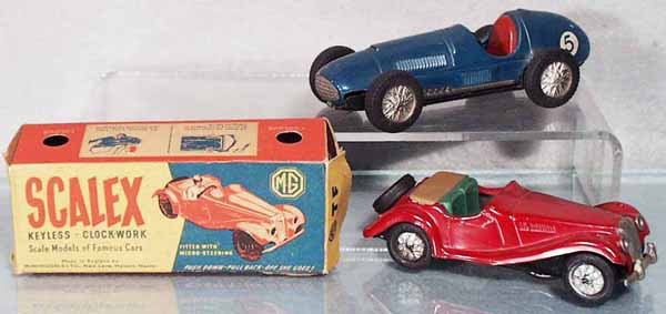 2 SCALEX AUTOS: MGA, orig box worn, Ferrari, both missing steering wheels, C5-6.