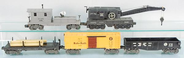 5 LIONEL FREIGHT CARS: O ga, 2420 searchlight caboose, 2420 crane, 3451 automatic lumber car, 2454 merchandise car, 2542 gondola, orig boxes & inserts minor wear, 1 flap loose, C7-8.