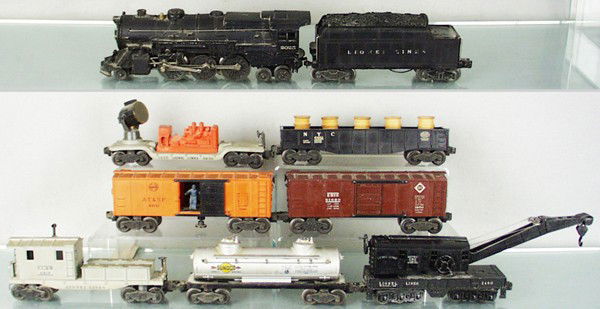 LIONEL TRAIN SET: O ga, 2025 loco, missing jewels, nose Keystone decal replaced w/sticker, 2466WX tender, 1 truck repainted, 3620 searchlight generator, 6462 gondola w/barrels, 3464 operating box car, 6454 box car w/ad