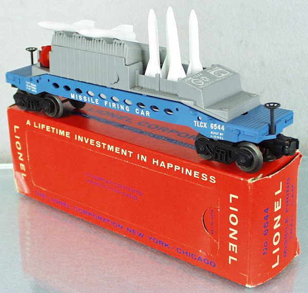 LIONEL 6544 MISSILE-FIRING TRAIL CAR: O ga, both brakewheels intact, control panel is white, orig box minor wear & taped, C9.