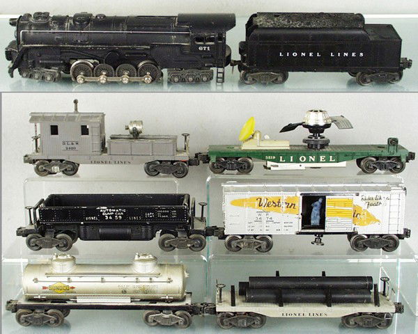 LIONEL TRAIN SET: O ga, 671 turbine, 6466W tender, w/repro shell, 6411 pipe car, 6465 Sunoco tank, 3474 WP box car, decals chipped, 3459 dump car, 3519 satellite launching car, 2420 searchlight caboose, 1 chip on tool