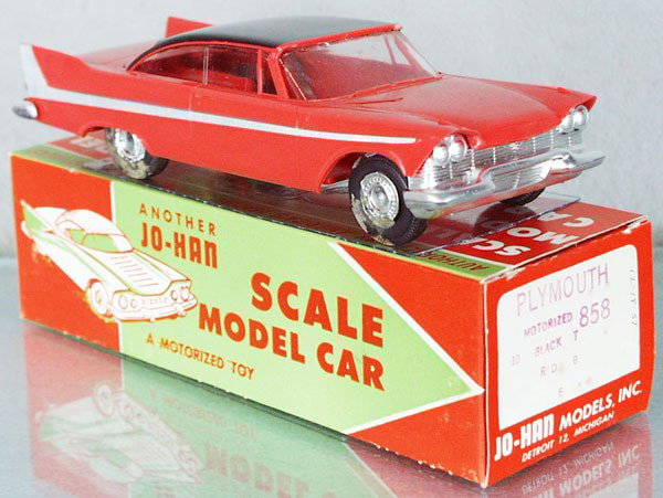 JO-HAN 1958 PLYMOUTH FURY PROMO: coral & black, friction working, no interior, minor body warp, wheel hubs melted, orig box minor wear, cellophane intact, C7-8.