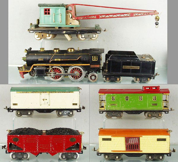 LIONEL TRAIN SET: std ga, 390E loco, 390T tender, missing coal load, 219 crane, surface oxidation on unpainted parts, 514 reefer, missing brakewheel, 516 hopper, 514 stock, doors repainted, 517 caboose, roof repainted,