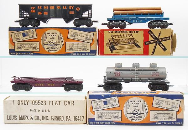 4 MARX SEPARATE SALE FREIGHT CARS: O ga, plastic, 21429 LV hopper, 5594 side-unloading log car, 4528 flat car, 284 tank car, orig boxes minor wear, 1 box incom, C7-8.