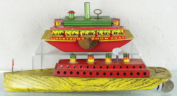 2 LINDSTROM BOATS: Show Boat, 8" long, windup working, Oceanliner, 14 1/2" long, windup working, both are litho & painted pressed steel, C5-6.