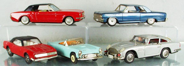 5 TIN JAPANESE AUTOS: litho tin, friction working, Bandai Mustang, 8" long, Bandai Chevelle, 8" long, missing 2 hub caps & window plastic, Camaro, 7" long, Bandai T-Bird, 7" long, ASC James Bond Aston Martin, 8" long, work
