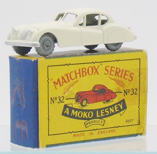 MATCHBOX 32A1 JAGUAR: cream body, matte black base, silver trim on front & rear, red tail lights, rear post has no web bracing, 10 X 18 metal wheels, flat crimped axles, B2 orig box minor wear, C8.