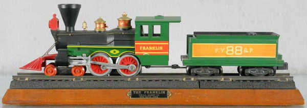 AMERICAN FLYER FRANKLIN PRESENTATION LOCO: S ga, 21088 Franklin loco & tender mounted on wood board by AC Gilbert, 1 of 50 made, some sunlight fading, red trim on loco domes peeling, C6.