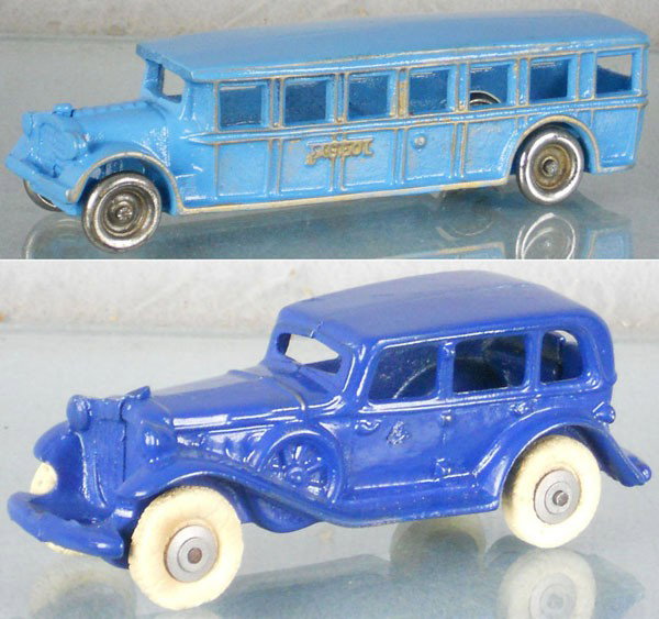 2 CAST IRON TOYS: painted cast iron, Arcade Fageol Bus, 8" long, AC Williams Sedan, 6 1/2" long, tires worn, both restored, C8.