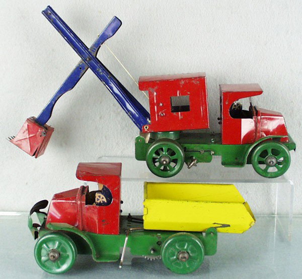 2 MARX MACK TRUCKS: litho tin, windup working, Steam Shovel, mising bumper, 8" long, Dump Truck, 9 1/2" long, C4-5.
