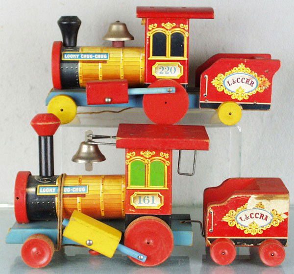 2 FISHER PRICE LOOKY CHUG CHUG TRAINS: 220 is 12" long, pull string missing ball end, 161 is 13 1/2" long, some wear to paper on tender, both are litho paper & painted wood, C4-6.
