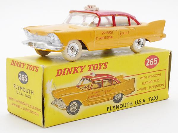 A small collection of Dinky Toys cars and commercial vehicles, including a No. 265 Plymouth USA taxi