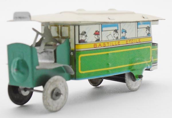 FRENCH PENNY TOY BUS: litho tin, 3 1/4 in long, Bastille Etoile on sides, w/driver, C8.