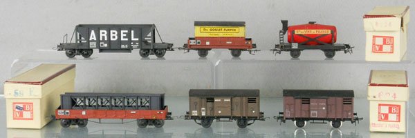 6 VB FREIGHT CARS: HO ga, French, 1950's, 59E flat w/girder sections, orig box, 624 stock car, orig box worn, stock car, orig box labeled 634, wine car, 1 sticker incom, some oxidation near 2 buffers, Arbel coal hopper,