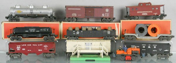 9 LIONEL FREIGHT CARS: O ga, 6415 tank, orig box worn, 3484 PRR box car, orig box worn, 6417 NYC zone caboose, orig box worn, 3469 dump car, 6462 gondola, 6561 cable flat, 6456 hopper, 3472 milk car w/platform, 3456 hopper,