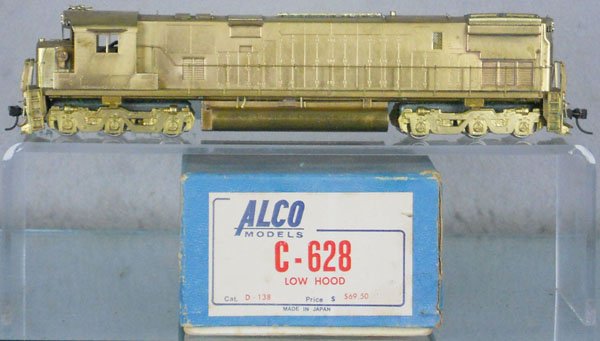 ALCO C-628 LOW HOOD DIESEL LOCO: Japan, HO ga, 2-rail, unpainted brass, some light tarnishing, slight foam insert residue on trucks, orig box minor wear, no insert, C7.