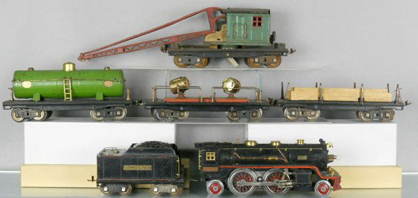 LIONEL TRAIN SET: std ga, 390E loco, partially rewheeled, 384T tender, 211 lumber, 215 tank, 220 searchlight, 219 crane, hook not shown in photo, set is playworn, dirty & has some oxidation, C4-5.