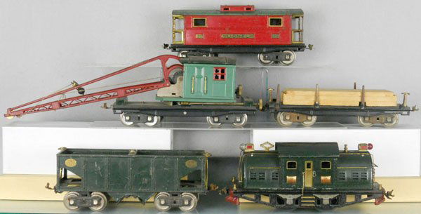 LIONEL TRAIN SET: std ga 380E loco, missing side door handrails, roller pickups are incom, 216 hopper, 211 lumber car, 219 crane, 217 caboose, set is playworn, dirty & has some oxidation, C4-5.