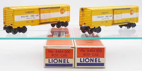 2 LIONEL 6464-500 TIMKEN BOX CARS: 0 ga, 1st version molded in yellow w/ice hatch visible, 3rd version w/ribbed roof & plastic trucks, orig boxes minor wear, all flaps intact, C8-9.
