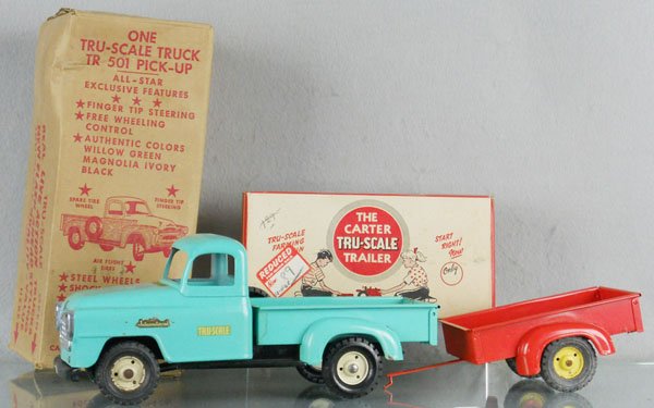 CARTER TRU-SCALE TRUCK & TRAILER: painted pressed steel, 501 International Pick Up, 12" long, some oxidation spots, 302 Trailer, 9" long, orig boxes some wear, C6-8.