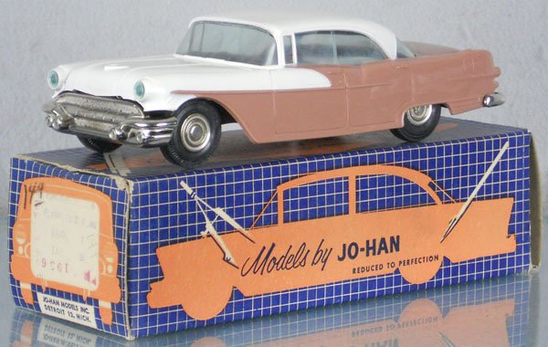 JOHAN 1956 PONTIAC PROMO: plastic, tan & white, friction working, body warped, orig box minor wear, C8.
