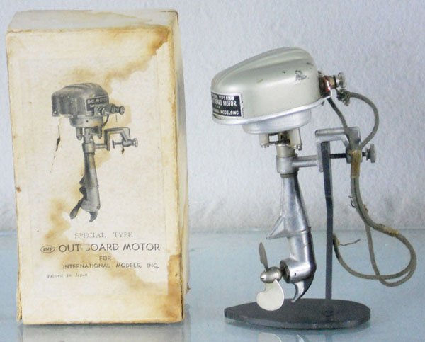 INTERNATIONAL MODELS OUTBOARD MOTOR: Japan, die cast, battery operated, not tested, 5" tall, some small dents in housing, orig box worn & waterstained, stand not included, C8.