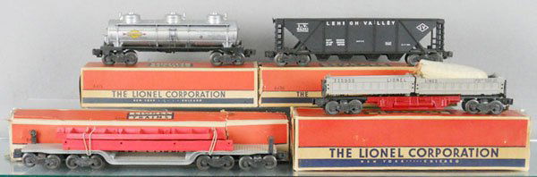 4 LIONEL FREIGHT CARS: O ga, 6415 tank car, 6436 hopper, 6418 machinery car, 3359 operating dump car, orig boxes worn & incom, C7.