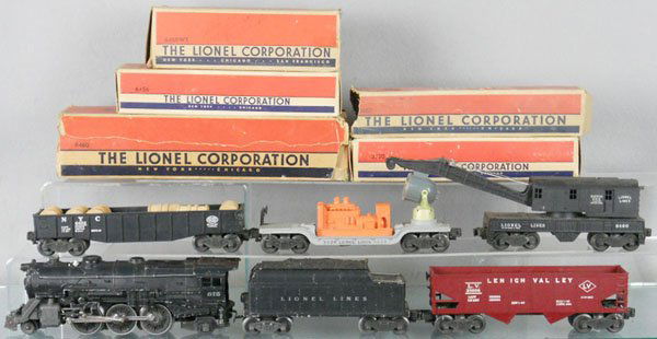 LIONEL TRAIN SET: O ga, 675 loco, 1 jewel lamp broken, 6466wx tender, 2 layout paint spots, 6456 hopper, 3520 searchlight, 6462 gondola w/barrels, 6460 crane, missing hook & die cast crank, 5 orig boxes only, rough, C5