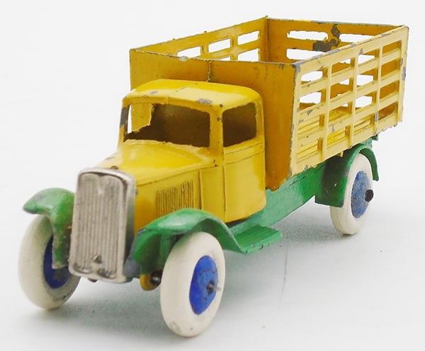 DINKY 25F MARKET GARDENER'S LORRY: Yellow & green, white rubber tires, blue metal hubs, some die cast fatigue in open frame, tow hook intact, chrome grille, paint chips, ca 1930s, C5-6.