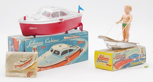 SCHUCO WATER SKIER SET: Plastic, 5511 Cabino Boat, battery operated, w/steering wheel, 9 in long, 3009 Flotano Boy Skier, green suit, w/instructions, orig boxes minor wear, C7-8.