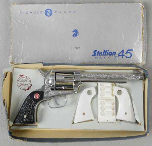 NICHOLS STALLION 45 CAP PISTOL: die cast, 12" long, w/grips & bullet holder, orig box & insert worn, C7-8.