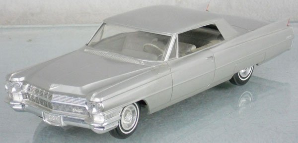JOHAN 1964 CADILLAC PROMO: plastic, silver gray, friction working, some box rubs on roof & trunk, C8.