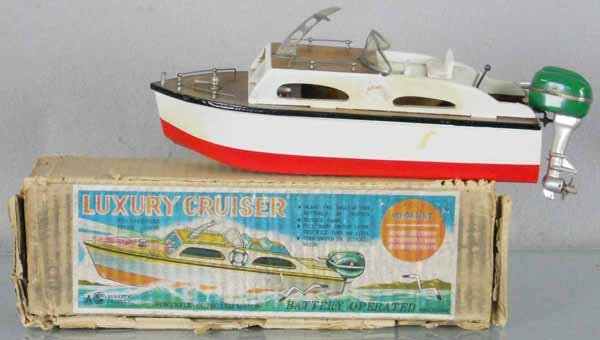 JAPANESE LUXURY CRUISER: wood, 10 1/2" long, battery operated, not tested, w/metal outboard motor, life preserver loose, orig box worn, C6-7.