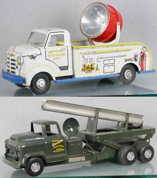 MARX & BUDDY L TRUCKS: painted pressed steel & litho tin, Marx Searchlight, 18" long, some surface oxidation in bed, Buddy L Missile Launcher, 20" long, missing missile, C6-7.