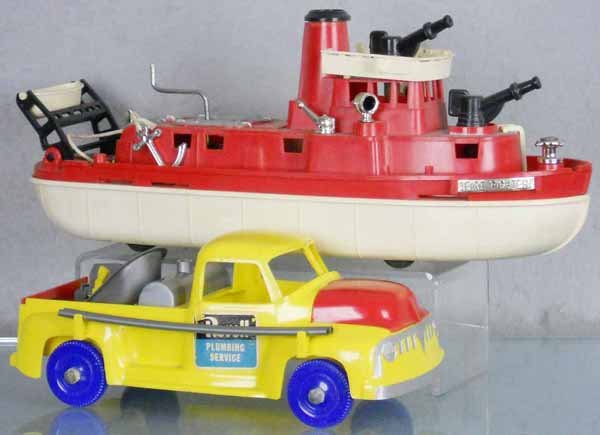 IDEAL & REVELL TOYS: Ideal Fire Fighter Tug Boat, 15" long, w/siren noise, Revell Plumbing Truck, 10" long, w/20 accessories, C6-7.