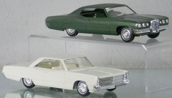 2 PROMO AUTOS: MPC 1970 Pontiac Bonneville, dark green, w/coin slot, Johan 1967 Fury, white, windshield cracked, missing hood ornament, C7-8.