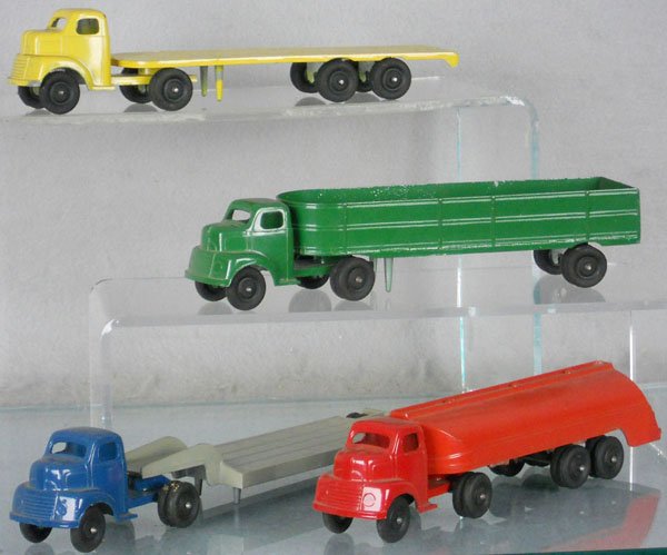4 RALSTOY TRUCKS: die cast, all have Ford tractors, C7-8.