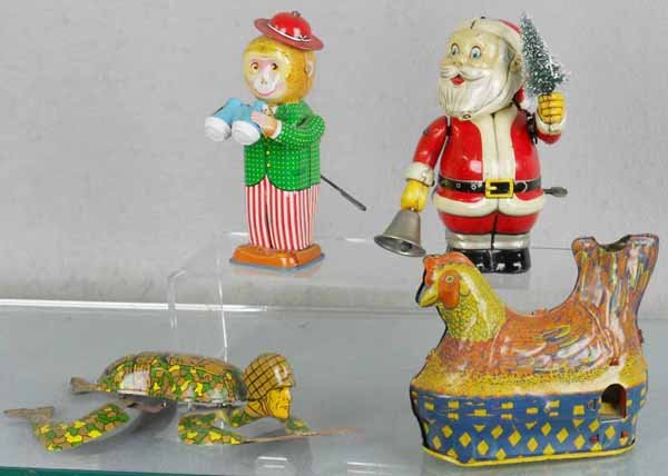 4 WINDUP TOYS: litho tin, Monkey w/Binoculars, 6" tall, TN Santa, 6" tall, Ohio Art Crawling GI, 9" long, Baldwin Hen Laying Eggs, 5" lot, all are windup working, C5-7.