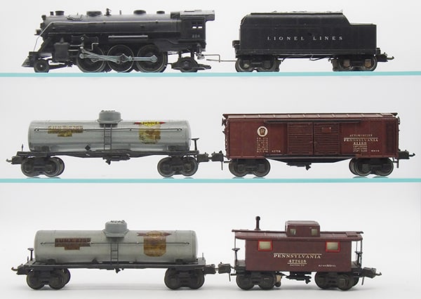 LIONEL TRAIN SET: O ga, 224 loco, 2224W plastic tender, 2 #2755 Sunoco tanks, decals yellowing, 2758 PA box car, 2757 caboose, layout paint drops on roof, C5-6.
