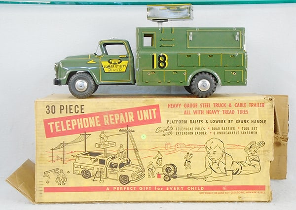 LUMAR 9000S TELEPHONE REPAIR UNIT: litho tin, 18 in long, plastic accessories including tools & people in orig paper bag, w/instructions, missing telephone pole ladders, trailer & poles, orig box worn, C7-8.