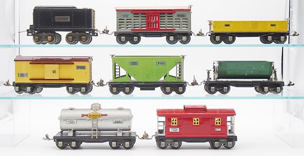 LIONEL FREIGHT CARS: O ga, 262T tender, 656 stock car, small touch up spot on roof, 652 caboose, 655 box car, 653 hopper, 659 dump car, 654 Sunoco tank, 657 caboose, C5-6.