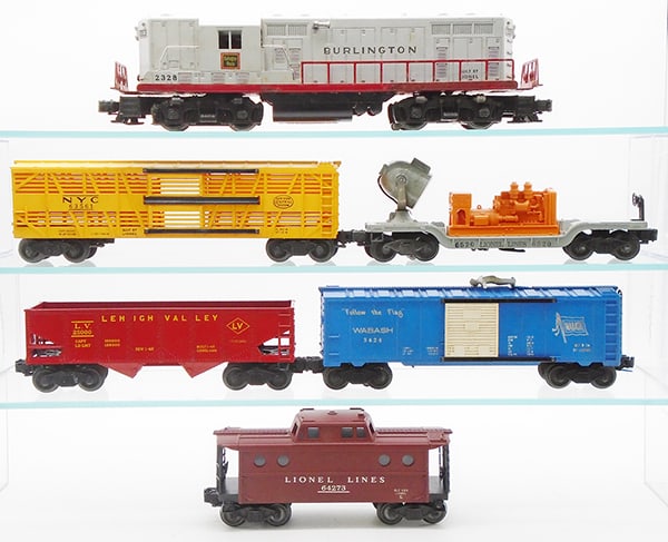 LIONEL TRAIN SET: O ga, 2328 Burlington loco, 6356 NYC stock car, 6520 searchlight car, 6456 hopper, glossy red & yellow version, 3424 operating brakeman car, 6427-1 caboose, orig boxes & inserts worn, C6-7.