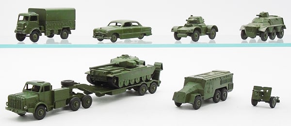 DINKY MILITARY VEHICLES: 623 Army Wagon, 675 Ford Sedan, decal worn, 670 Armoured Car, 643 Personnel Carrier, 660 Tank Transporter, 651 Centurion Tank, treads frozen, 677 Armoured Command Vehicle, 686 Field Gun, C6-8.