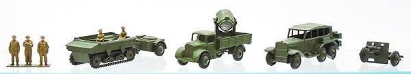 DINKY MILITARY VEHICLES: 162A Light Dragon Tractor, 162B Trailer, 22S Searchlight Lorry, 152B Reconnaissance Car, 3 tires flap, 162C 18 lb Gun w/5 figures, C7-8.