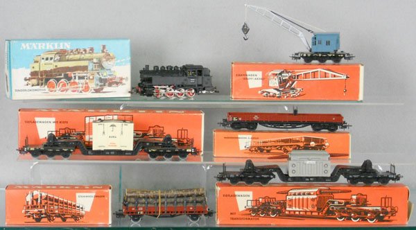MARKLIN TRAIN SET: HO ga, 3031 tank loco w/freight cars 4608, 4514 slight warp, 4611, 4617, missing 2 insulators, 4618, crate warped, orig boxes, some have wear or missing flaps, C7-8.