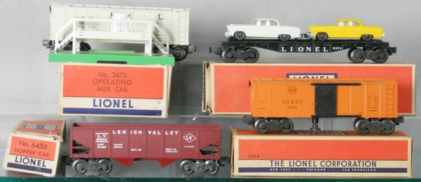 4 LIONEL FREIGHT CARS: O ga, 3472 milk car w/platform, 6424 auto flat, 6456 hopper, 3464 operating box car, orig boxes minor wear, C6-7.