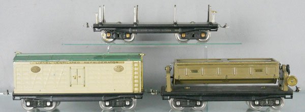 3 LIONEL FREIGHT CARS: std ga, 211 lumber flat, missing 1 brakewheel, 214R refrigerator car, 218 dump car, ends painted, crown gear fatiguing, C6.