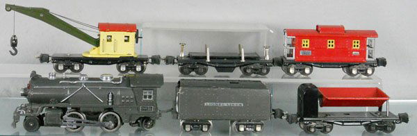 LIONEL TRAIN SET: O ga, 249E loco, 265W tender, 3659 dump, 2660 crane, 3651 operating flat, 2657 caboose, C5-6.