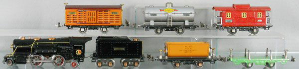 LIONEL TRAIN SET: O ga, 259 loco, 262T tender, 809 dump, 831 lumber flat, 806 stock car, 804 Sunoco tank, decals scratched, 807 caboose, C5.